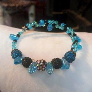 Pretty Czech beaded bracelet with crystals on memory wire in shades of t…